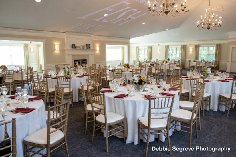 A wedding table setup in the ballroom at Butternut Farm Golf Club in Stow, Massachusetts